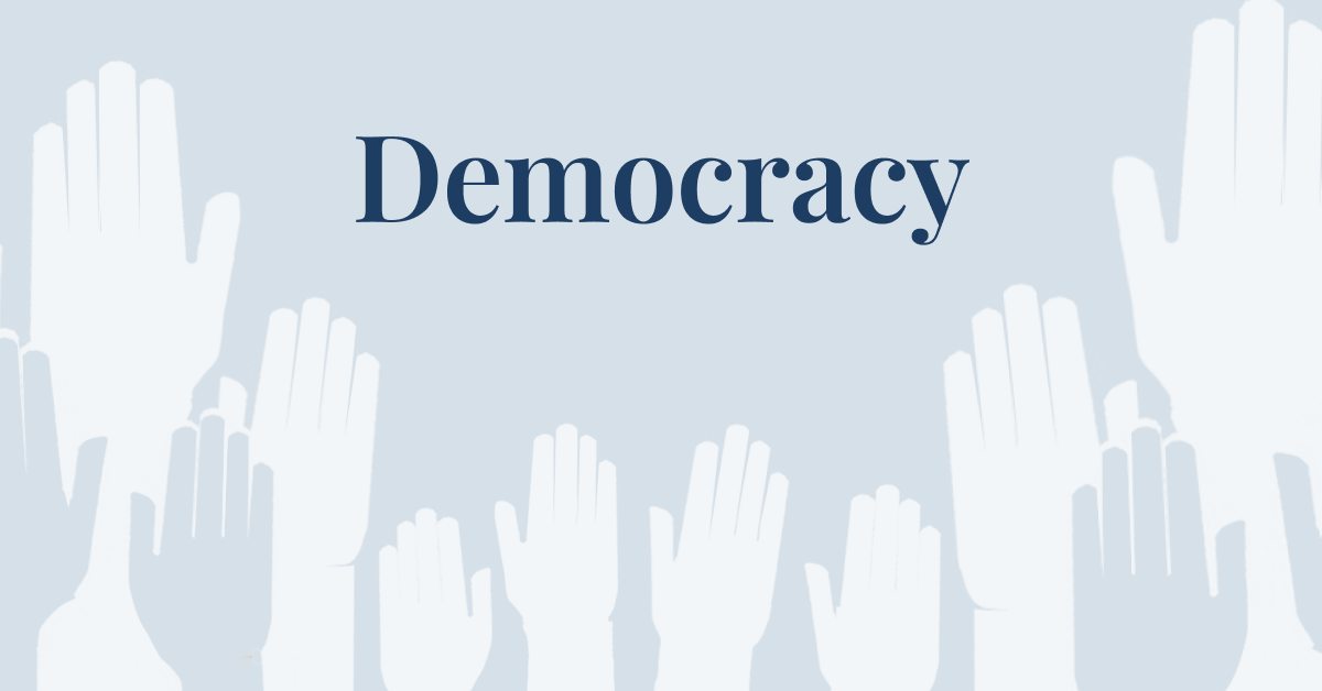 Featured image for the Democracy topic page. Stylized raised hands with topic page title in the middle.